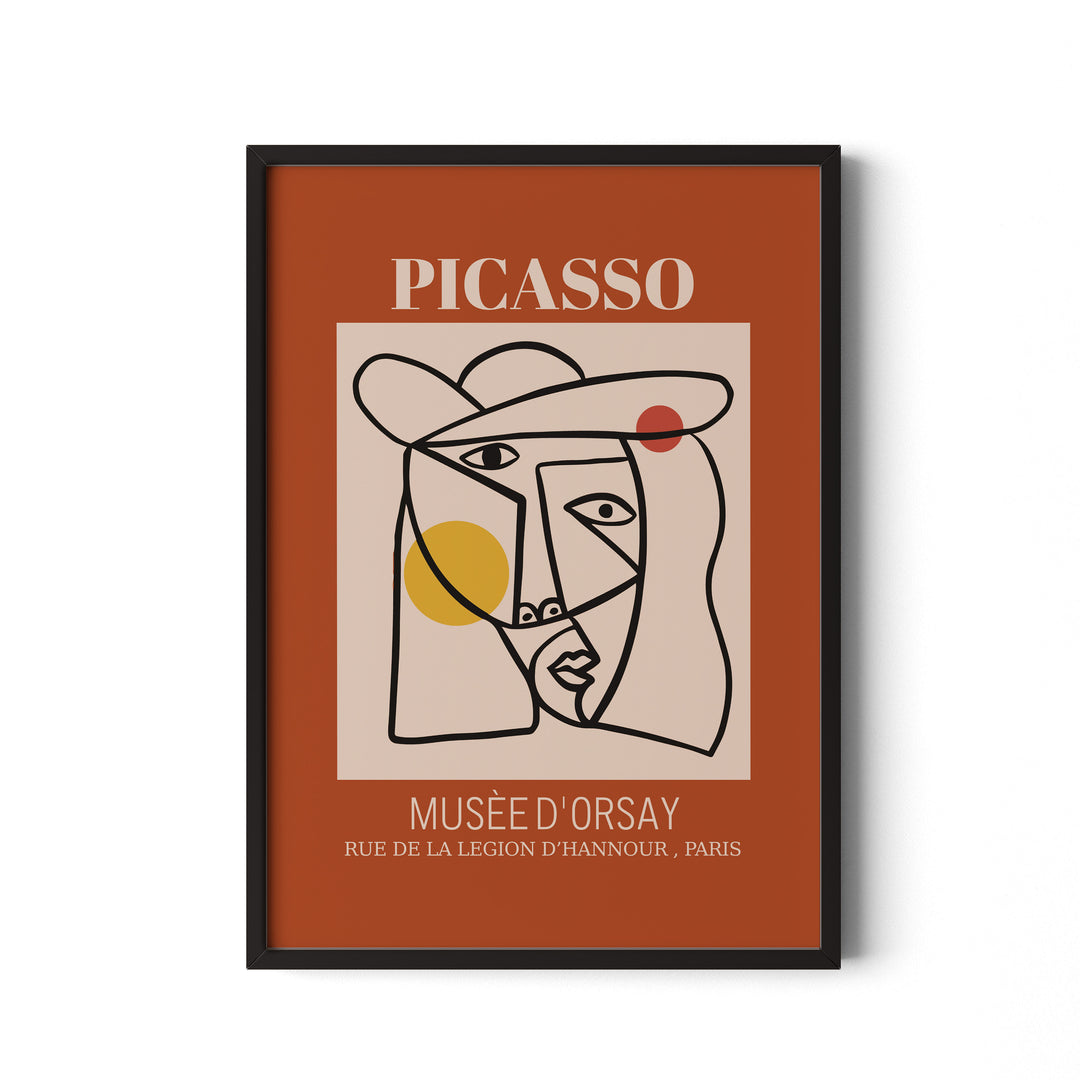 Framed artwork with Picasso face design on a brown background