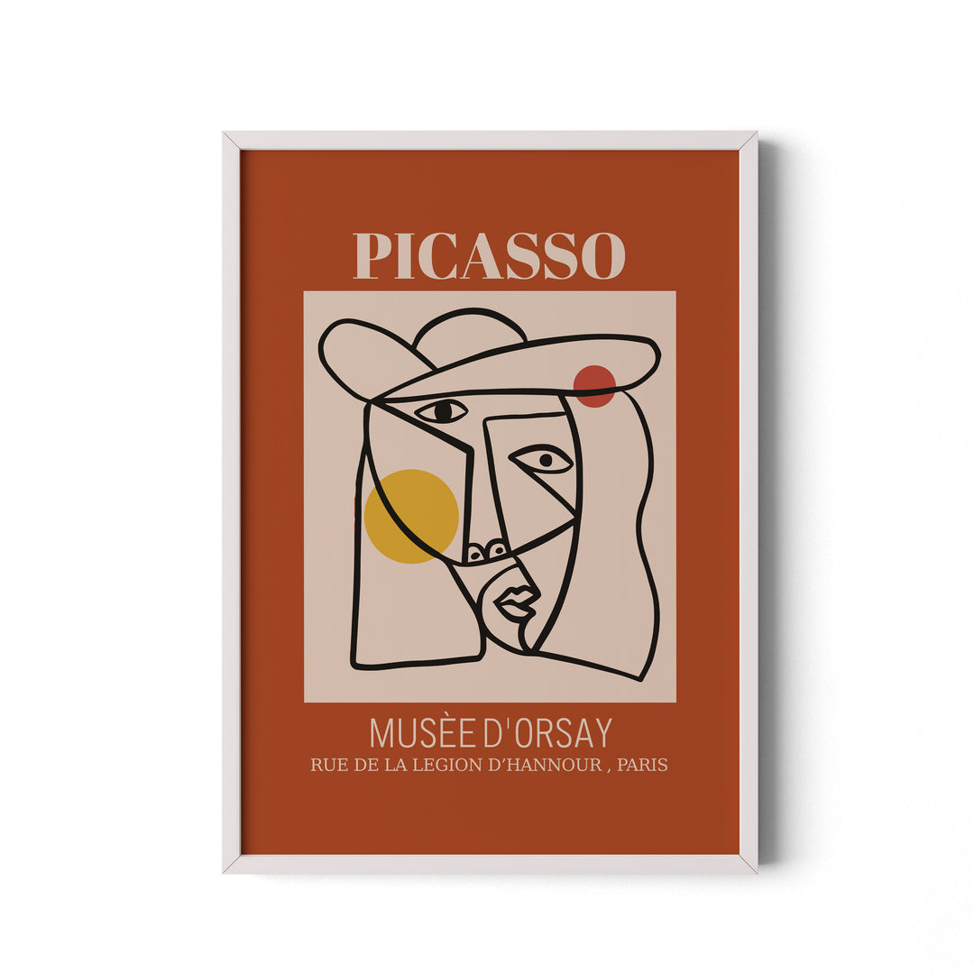 Framed artwork with Picasso face design on a brown background